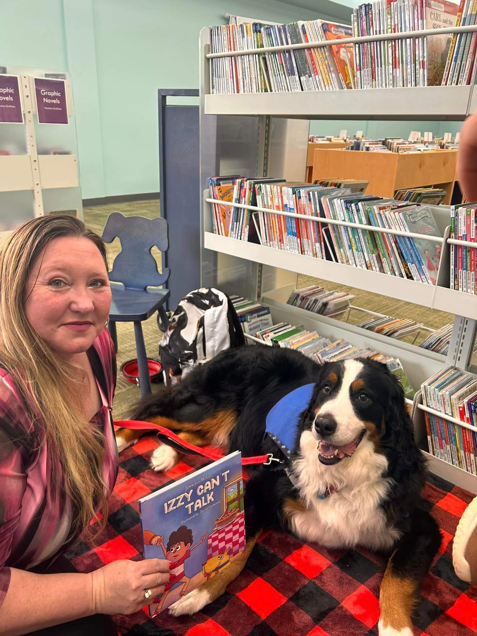 Jennifer reading Izzy Can't Talk to a service dog